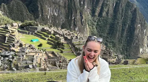 Georgie Swallow‍ Georgie on ​a trek in Peru