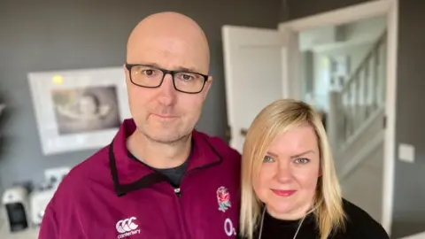 Nikki Fox/BBC Look East Ashley and his wife Sharon at home in Northamptonshire