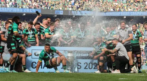 Getty Images Northampton Saints celebrate with the trophy after winning the Gallagher Premiership final