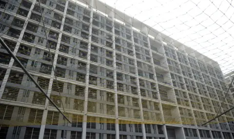 Getty Images A protective net added to a Foxconn employee dormitory in Shenzhen, China