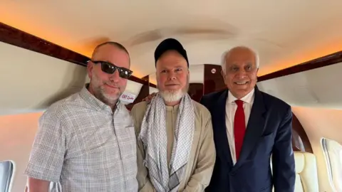 Dennis Coyle with former US ambassador Zalmay Khalilzad and UAE special envoy Saif Al Ketbi shortly after his release by Taliban authorities. 