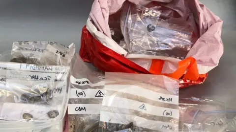 The British Museum Hoard in plastic bags on arrival at conservation lab