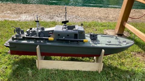 A military model boat with torpedoes and anti aircraft guns 