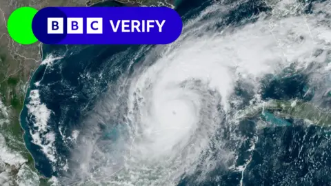 Reuters/NOAA Satellite image of Hurricane Milton over the ocean, labeled BBC Verify in the upper left corner.