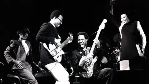 Getty Images Nile Rodgers (second right) on stage with Chic in 1979