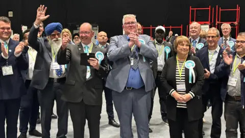 Reform candidates celebrate at the Coventry City Council election count.