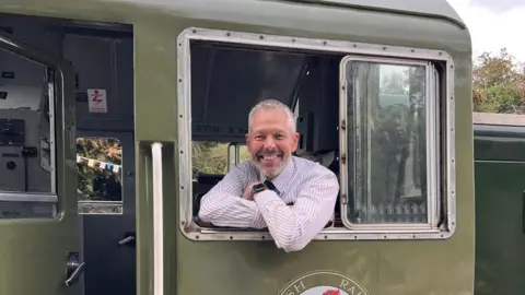Malcolm Holmes Malcolm Holmes in a train