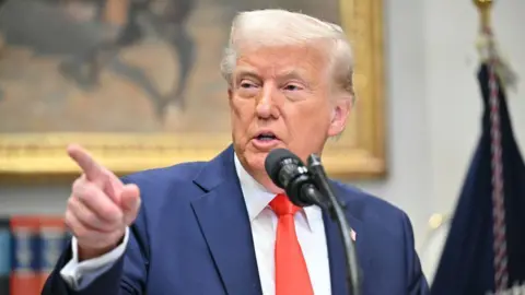 US President Donald Trump speaks in the Roosevelt Room of the White House 