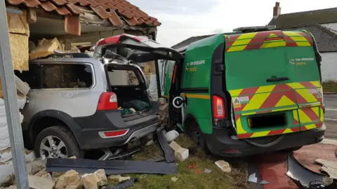 Family handout Volvo crashes into house