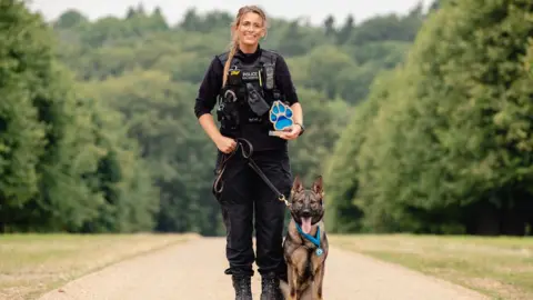 PA Media German shepherd Calli and PC Megan West