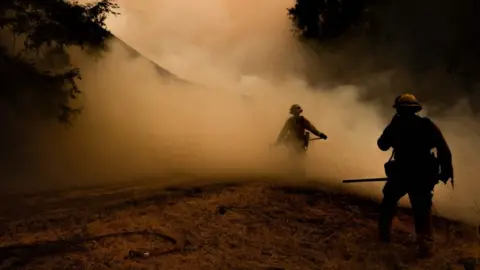 Getty Images Fire fighters report some progress at the Mendocino Complex Fire