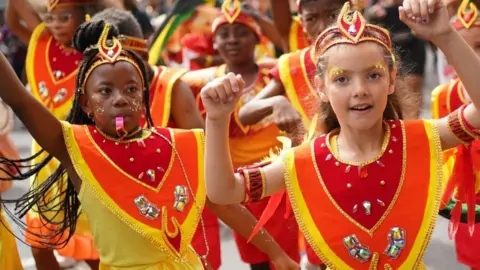 PA Media young performers at carnival