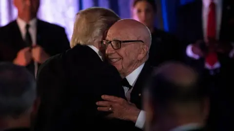 Getty Images Mr Trump met with Mr Murdoch in New York in May 2017