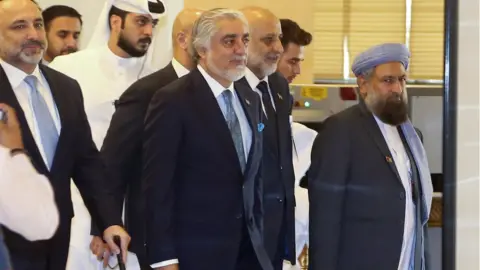 EPA Afghanistan Peace Grand Council chief, Abdullah Abdullah (C) arrives for the opening session of the peace talks between the Afghan government and the Taliban in Doha, Qatar, 12 September 2020