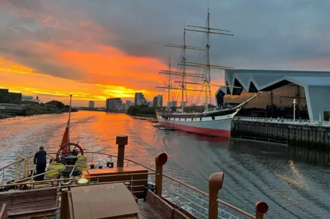 Andrew Comrie The Waverley passes the Tallship Glen Lee and the Riverside Museum in Glasgow