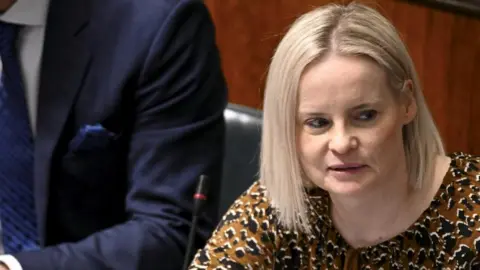 Reuters Riikka Purra, leader of the Finns Party, votes during the plenary session where Finnish Parliament voted on Finland's accession to NATO in Helsinki, Finland, March 1, 2023.