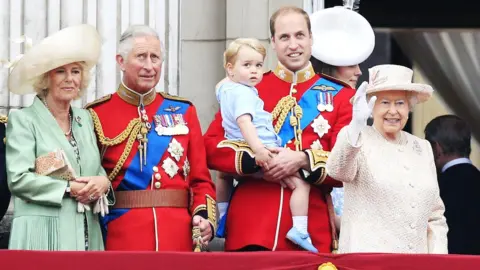 Jonathan Brady Prince Charles alongside his grandson Prince George