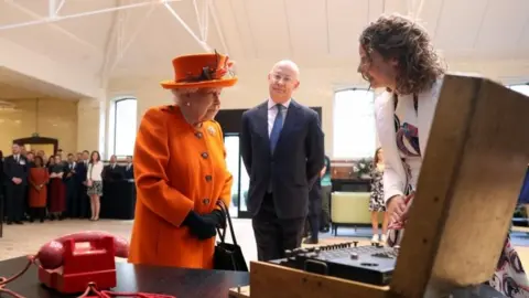 Reuters The Queen looking at Enigma machine