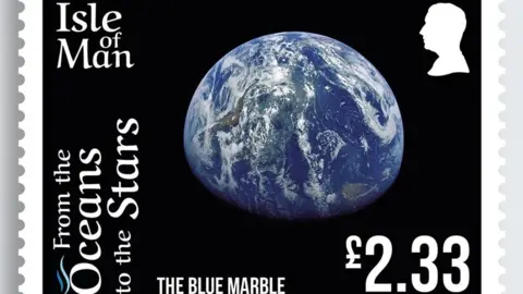IOM POST OFFICE A stamp featuring a large portion of the view of Earth from space. It is blue against a black background.