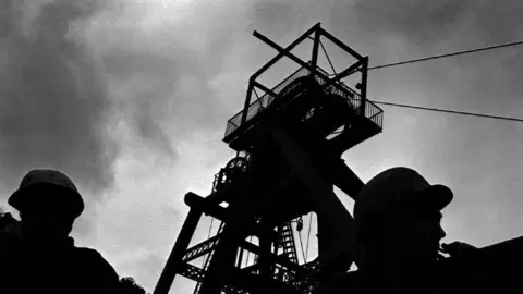 Roger Tiley Miners in silhouette at Celynen South before the strike had begun