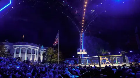 EPA A large crowd watches a fight in a temporary UFC Octagon on the South Lawn of the White House