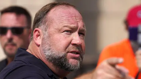 Getty Images  InfoWars founder Alex Jones speaks to the media outside Waterbury Superior Court