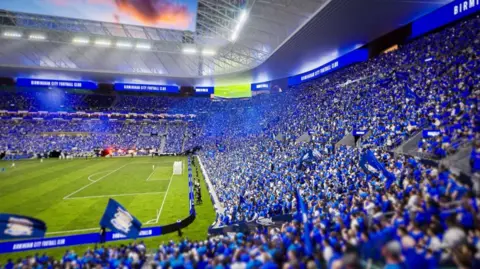 BCFC A computed generated image showing a stadium full of fans wearing blue.
