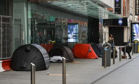 Getty Images A view of a rough sleeper's tents outside a closed shop on Henry Street in Dublin city centre