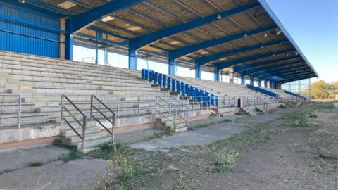 Grandstand of the former speedway track, the seats have been removed.
