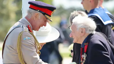 PA The King shaking the hand of a 99-year-old veteran