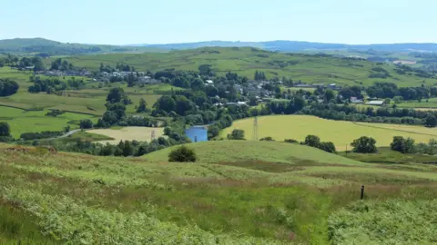 Graham Robson The view from Waterside Hill on the Southern Upland Way with rolling hills and the town of Dalry in the distance