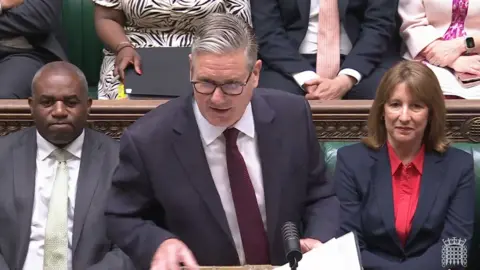 Starmer in a suit at the dispatch box