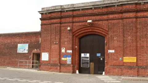 The red brick front of HMP Norwich