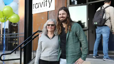 Gravity Dan Price with his mother