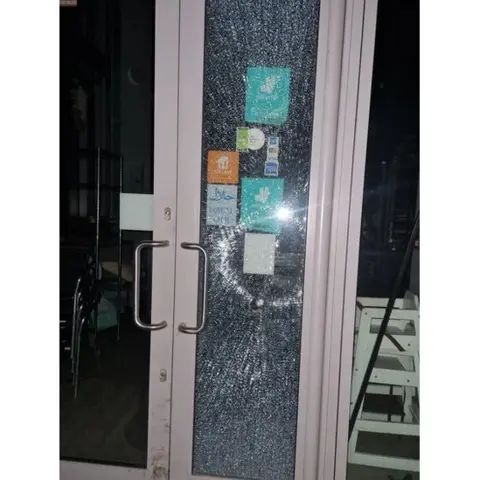 Local Democracy Reporting Service Petit Cafe doors smashed by vandals