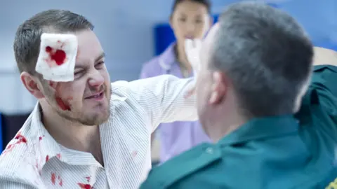 Getty Images Man punching NHS worker