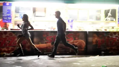 Getty Images woman and man running
