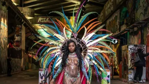 Aneesa Dawoojee Women of Mas' photo of woman in carnival dress