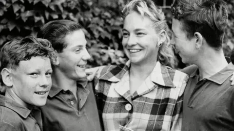 Wimbledon ball boys meet Darlene Hard, women's singles runner-up, at the 1957 Wimbledon Championship