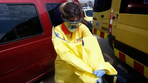 Getty Images A healthcare worker of the Emergency Medical Services of Catalonia (SEM) on 24 April 2020 in Sabadell