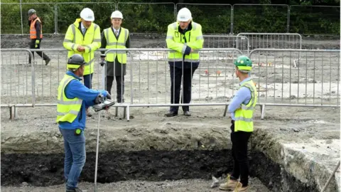 Getty Images Boris Johnson speaks to people building a road