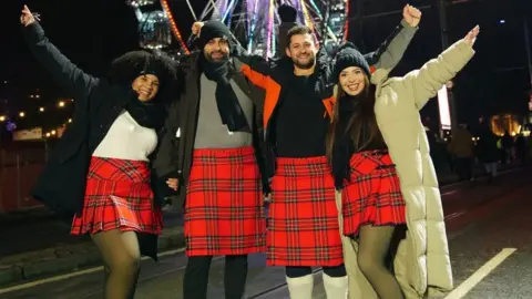 PA Media Revellers celebrate the start of 2024 in Edinburgh