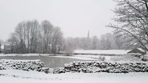 Hannah Mosteller Snowy field, house and church steeple