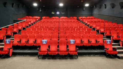 Getty Images Wheelchair spaces at a venue