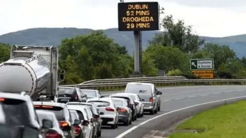 Reuters Traffic travels across Irish border