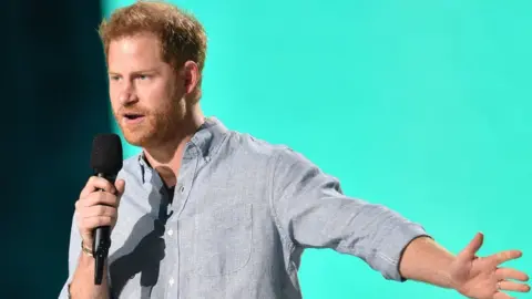 Getty Images Prince Harry speaking at Vax Live