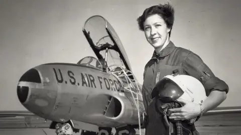 Wally Funk via Blue Origin Undated black and white image shows Wally Funk next to US air force aircraft