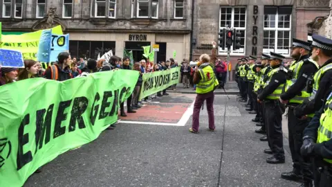 Jeff J Mitchell Climate change protesters block one of the main roads into Edinburgh's city centre on April 16, 2019 in Edinburgh