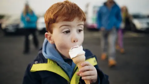 Getty Images Boy eating ice cream cone