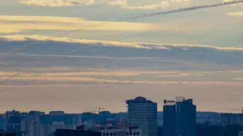 Getty Images An air defence missile moves to intercept a rocket over Kyiv